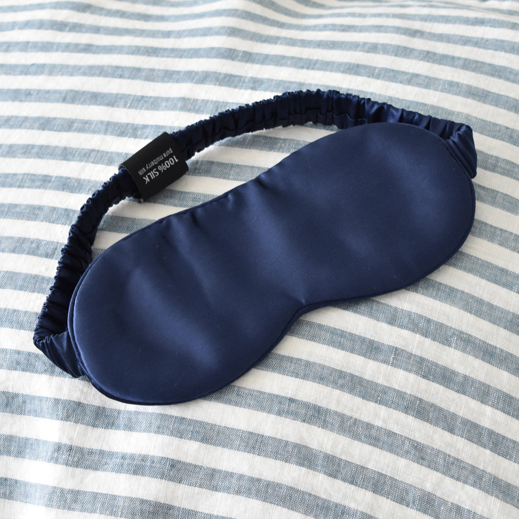 Navy Silk Eye Mask on Navy Stripe Linen Bedding