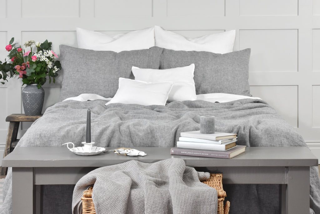 Light Grey Linen Duvet Set on a Bed with a Grey Linen Throw and White Linen Cushions