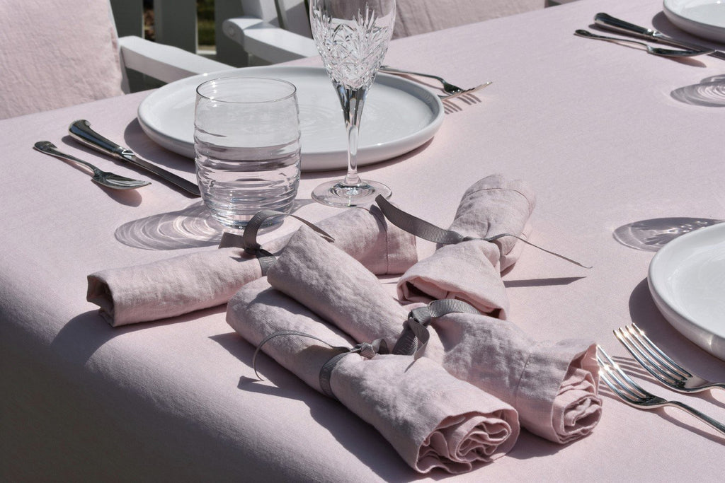 100% Linen Pink  Napkins with Glasses and  Plates on a Pink  Linen  Tablecloth