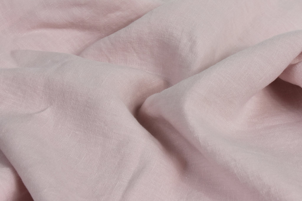 Washed Blush Pink Linen Sheet on a Bed