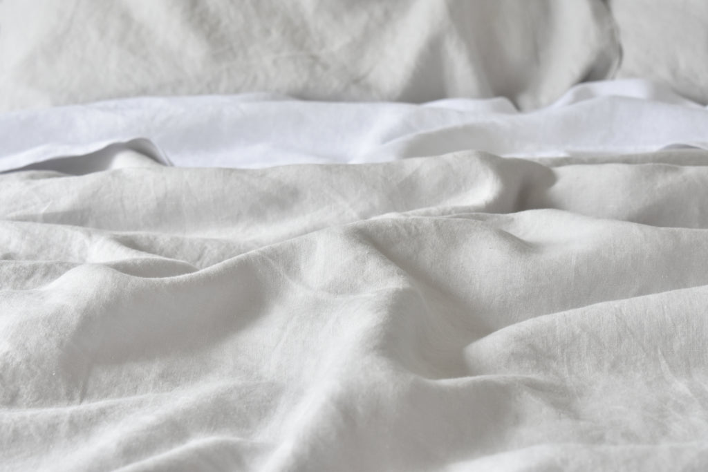 Soft Grey Linen Sheets on a Bed