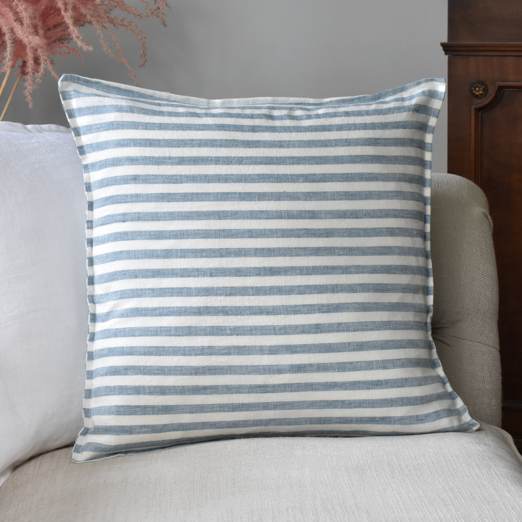 Blue Striped Ticking Linen Cushion Cover On A Sofa