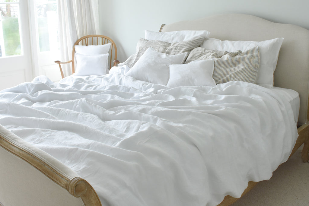 Super King Bed with Natural Linen Bedding in White with Ticking Pillowcase