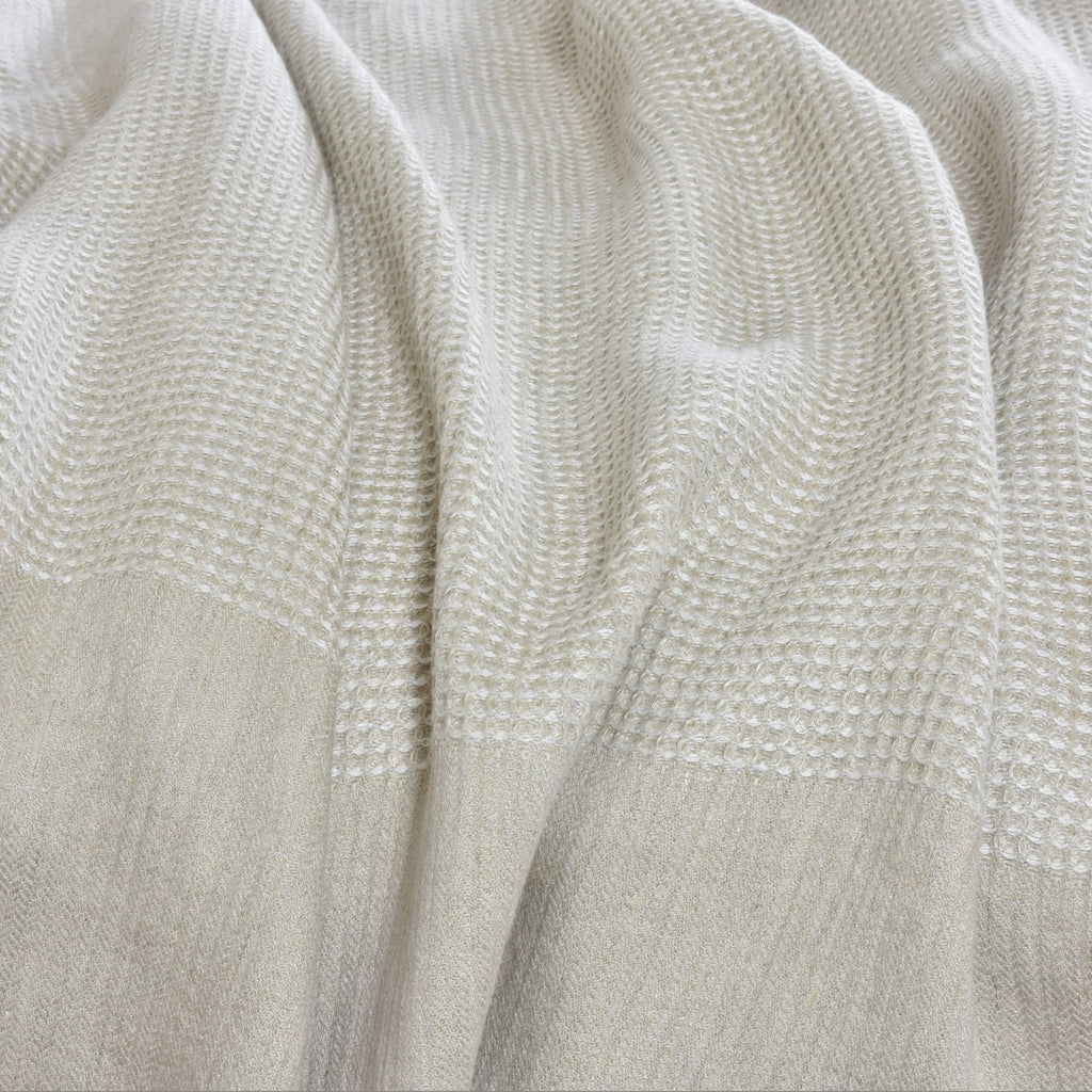A  Linen Blanket folded on a bed