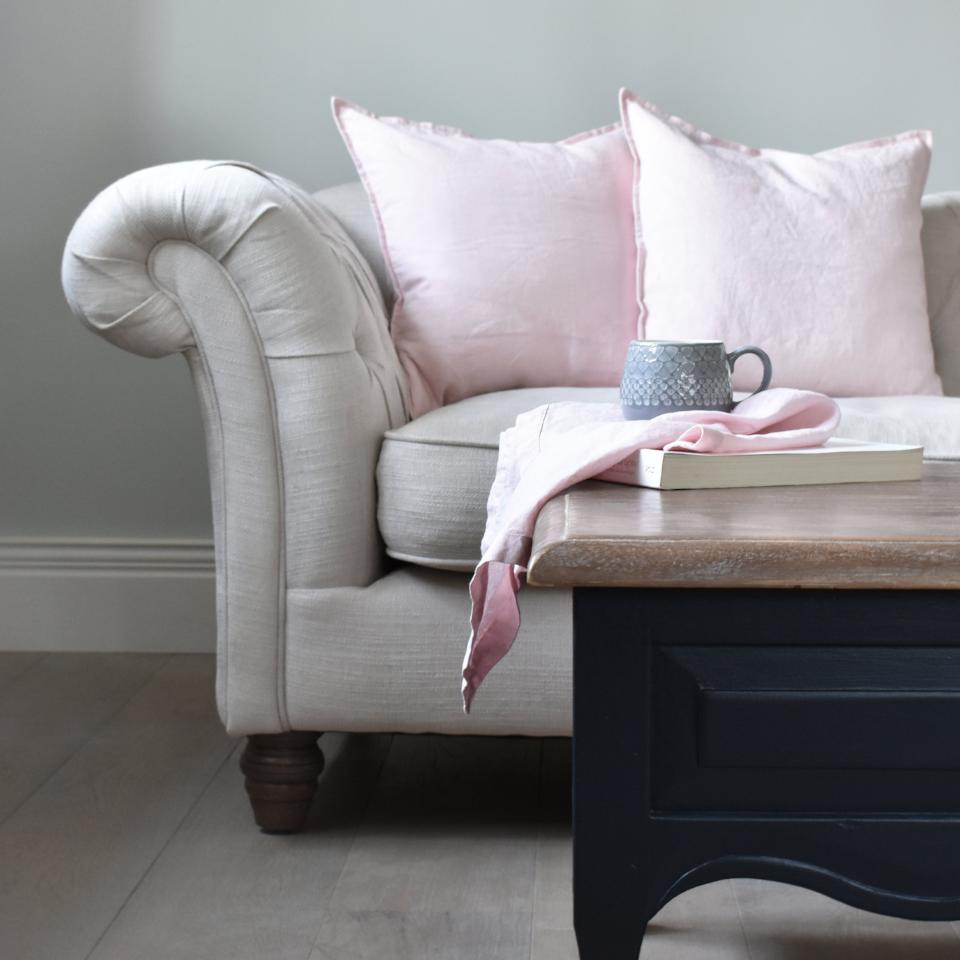 Pink Linen Cushions and Linen Napkins on a Coffee Table