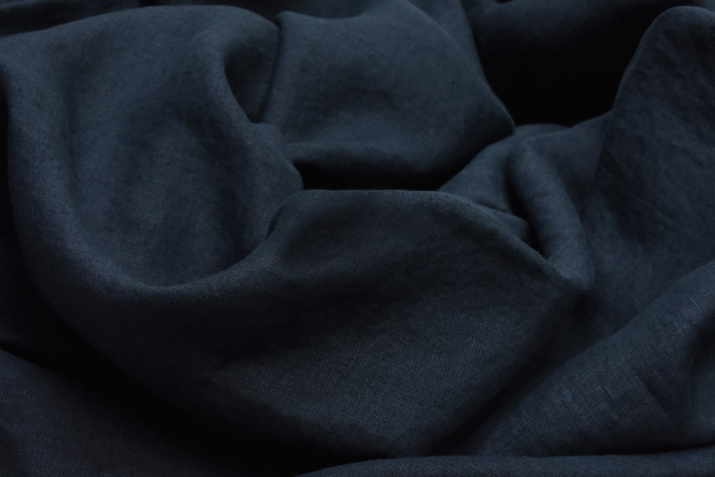 Dark Blue Linen Quilt Cover on a Bed