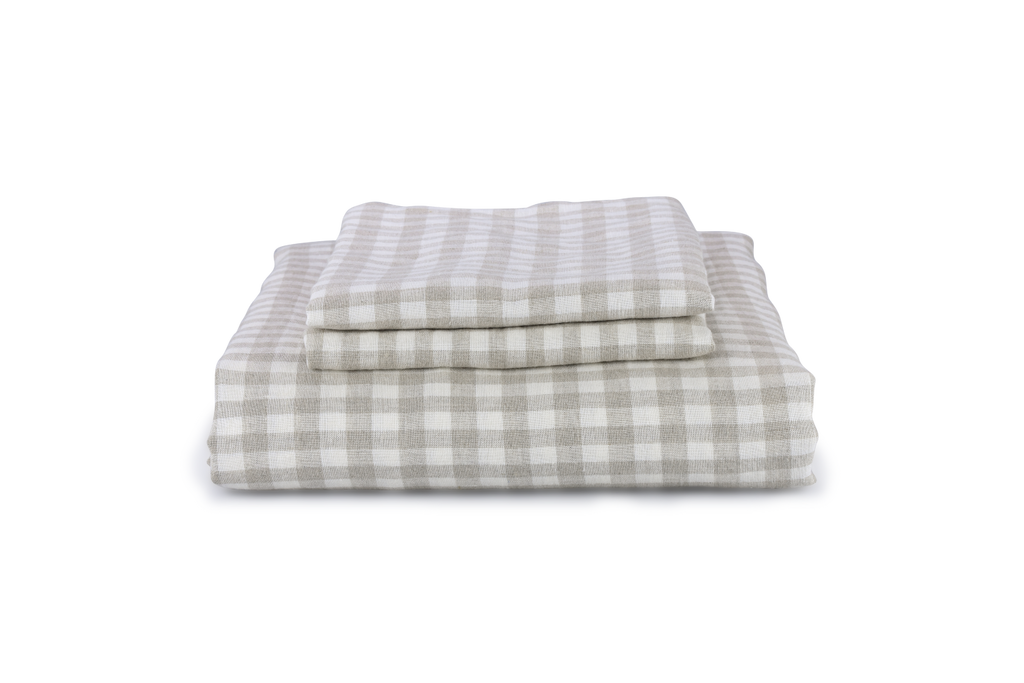 A Gingham Check Linen Duvet Cover and 2 Pillowcases Folded as a stack