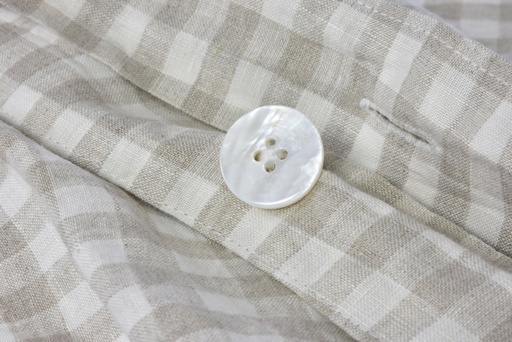 A Gingham Check Linen Bed Quilt Cover with a Pearl Button