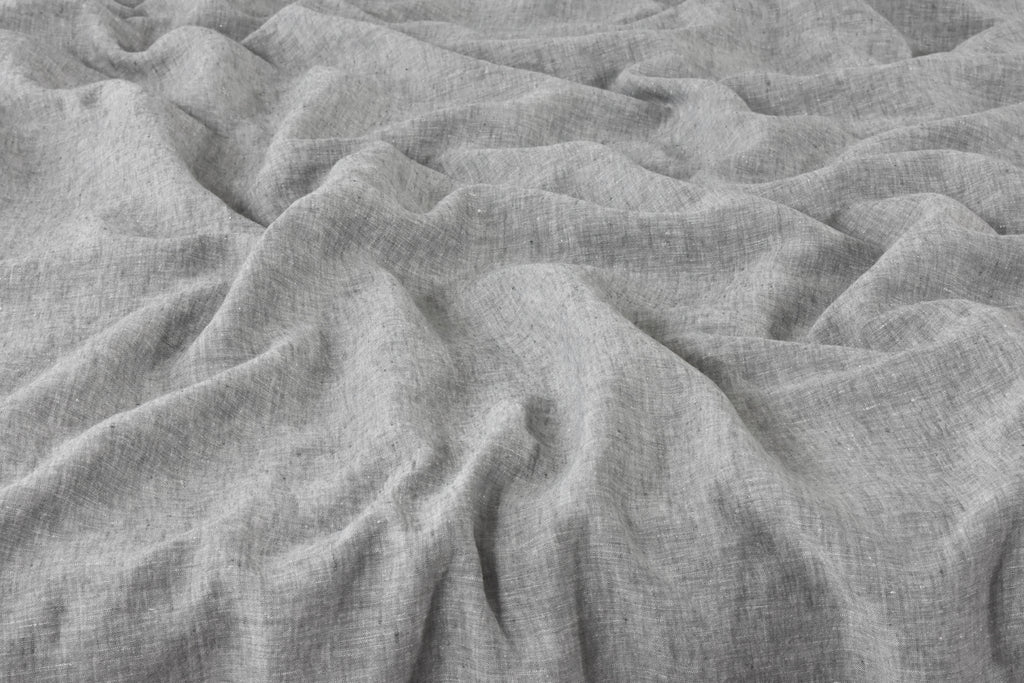 Grey Linen Fabric on a Bed with a Duvet Cover