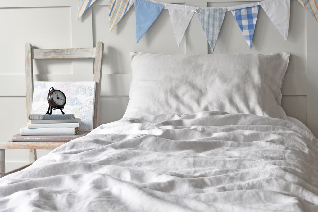 Bed with Kids Grey Linen Duvet Cover and Seaside Bunting