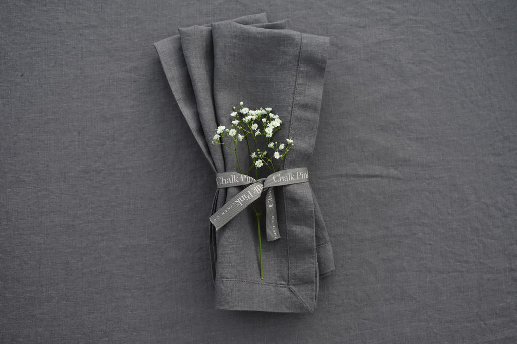 Charcoal Secret Grey Linen Napkins with ribbon tied around