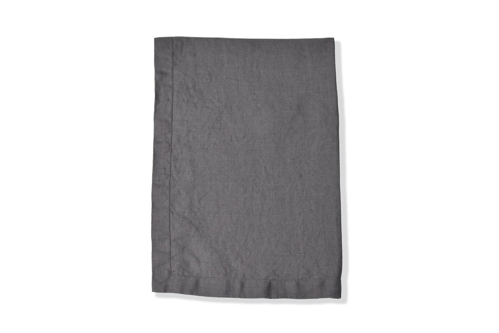 Dark Charcoal Grey Linen Table Runner Folded on a White Linen Sheet