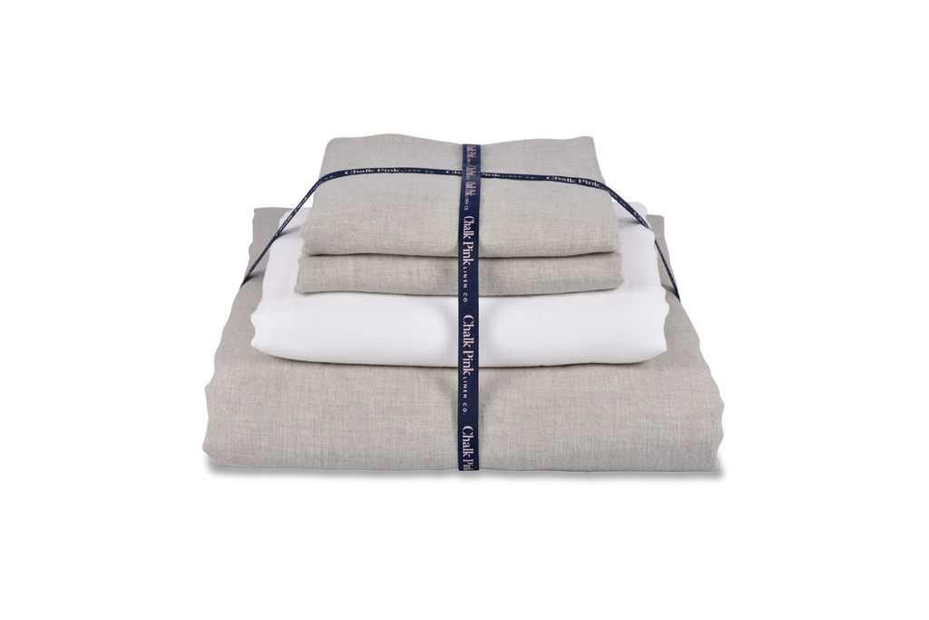 Natural Linen Duvet Cover and White Linen Sheet Folded in a Bundle