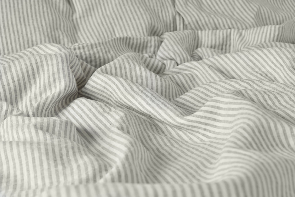 Stripe Ticking Bed Sheet on a Bed