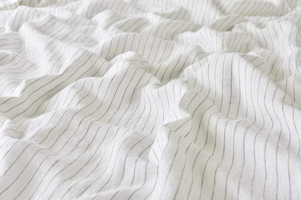 Pinstripe Linen Quilt Cover on a Bed