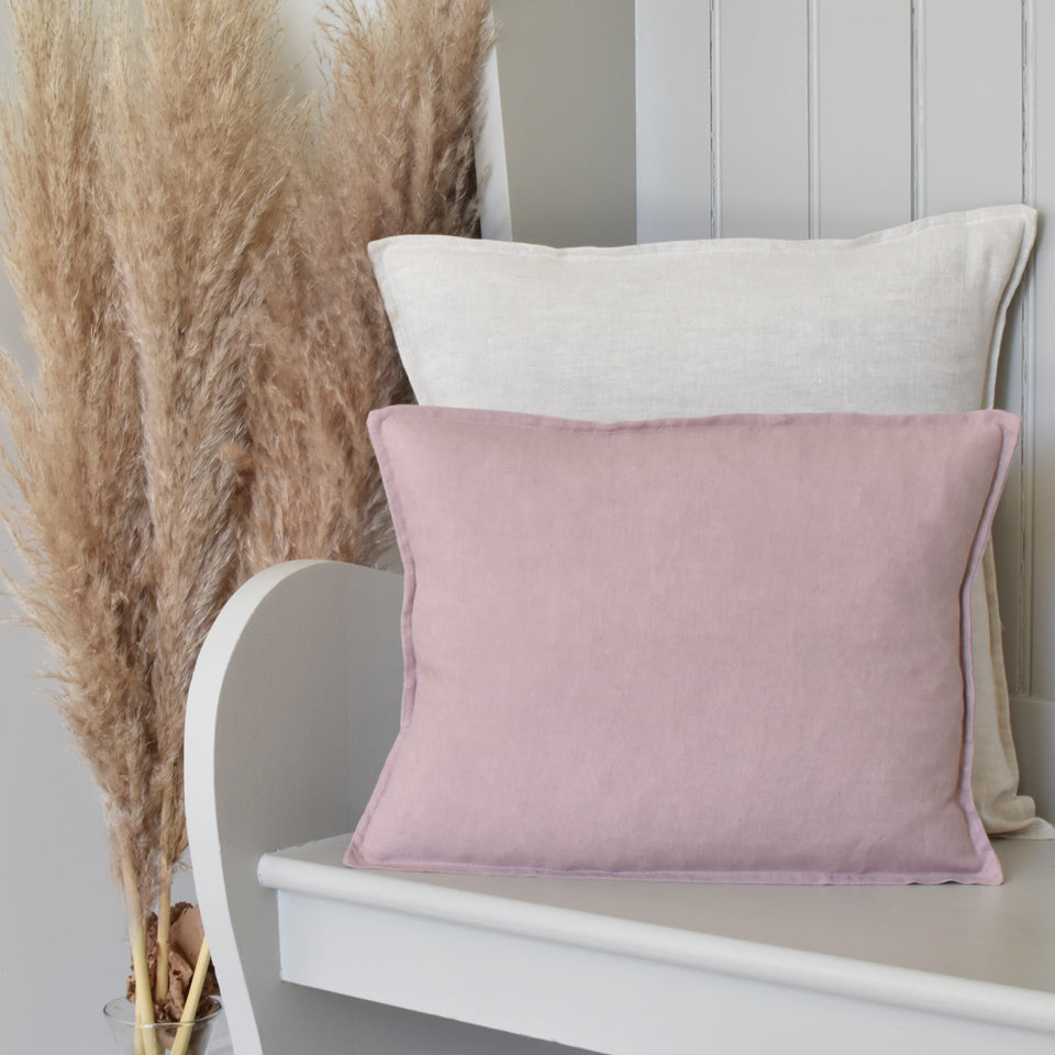 Small Linen Petra Pink Cushion On a Wooden Bench