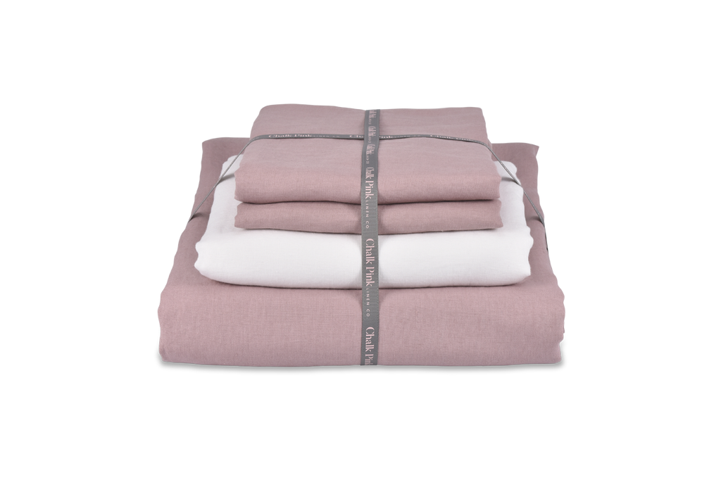Dusty Pink Linen Duvet Cover and White Sheet folded in a Bundle
