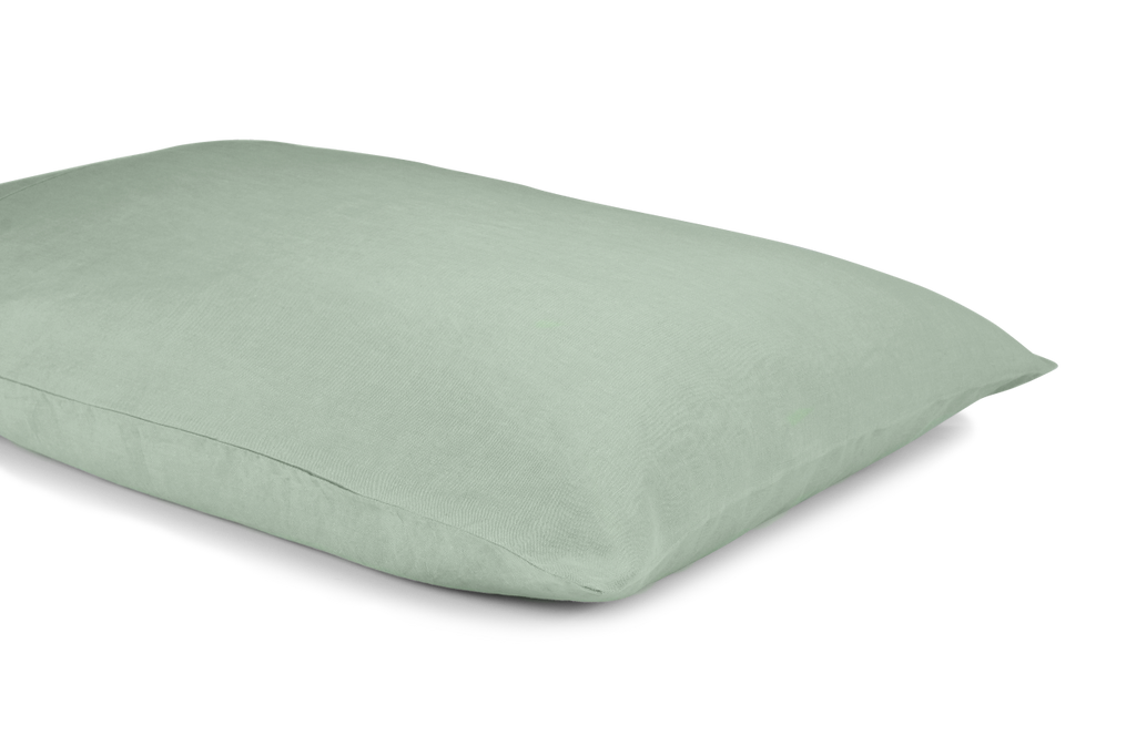 A Green Linen Pillowcase on a Pillow in a Cut Out Photo