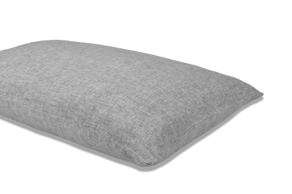 A Grey Linen Pillowcase on a pillow with a cut out background