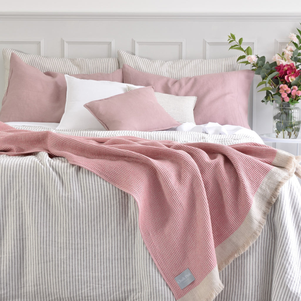 Dusty Pink Linen Throw On Striped Linen Bedding