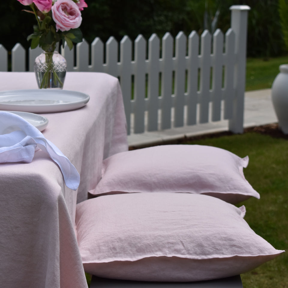 Blush Pink Linen Cushions on a Garden Bench