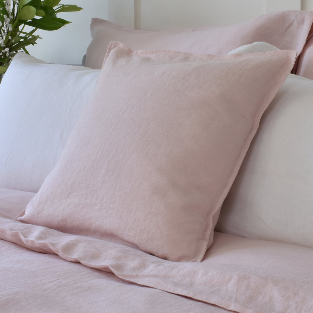 Pink Linen Cushion on Pink and White Bedding