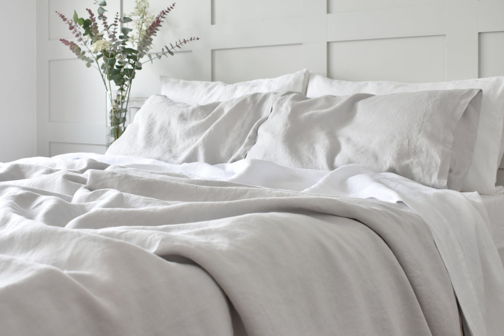 Silver Grey Bed Linen on a bed with white sheets