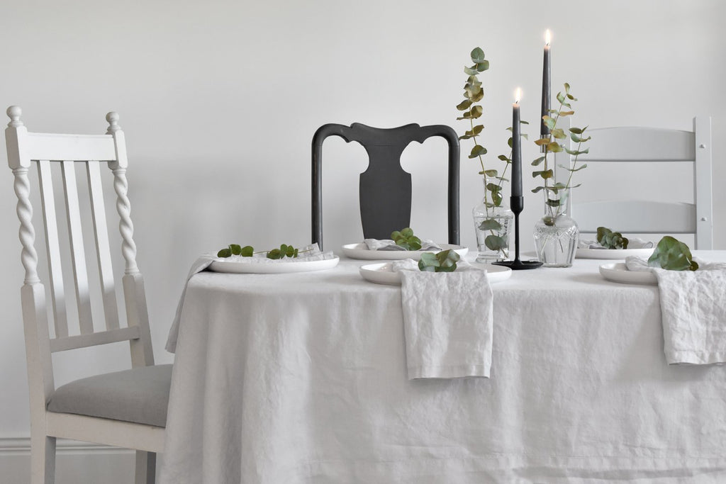 Light Grey 100% Pure Linen Tablecloth on a Dining Table with Cutlery and Candles