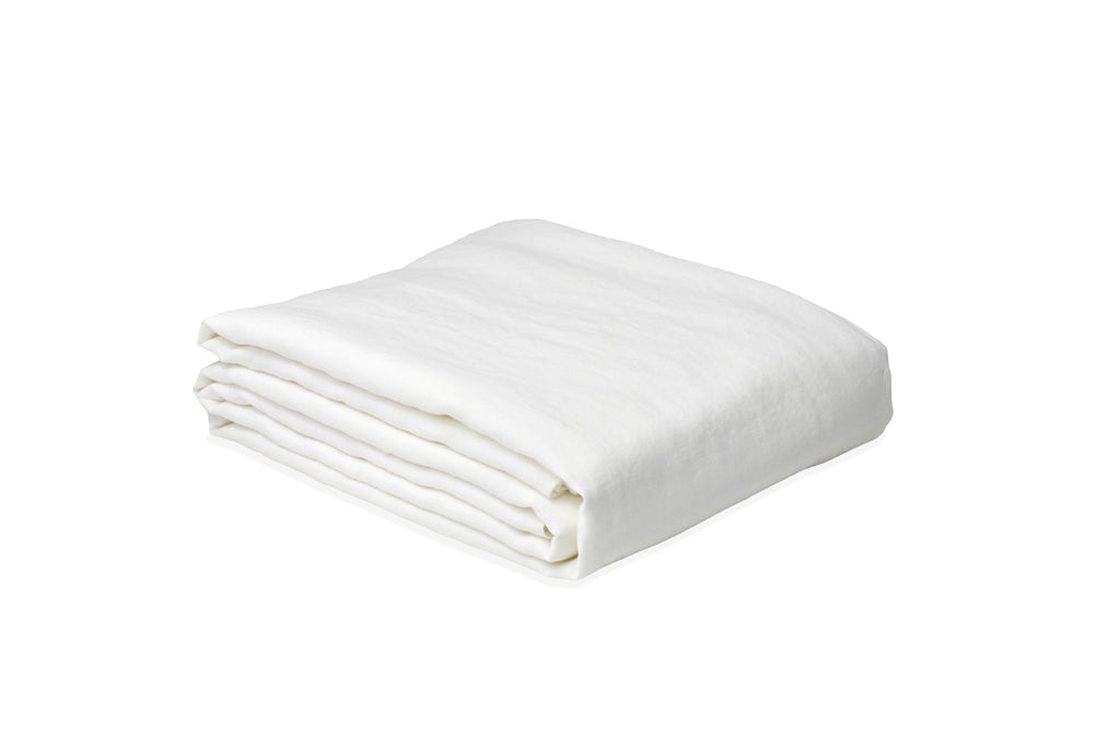 White Linen Duvet Cover Folded on a Linen Sheet