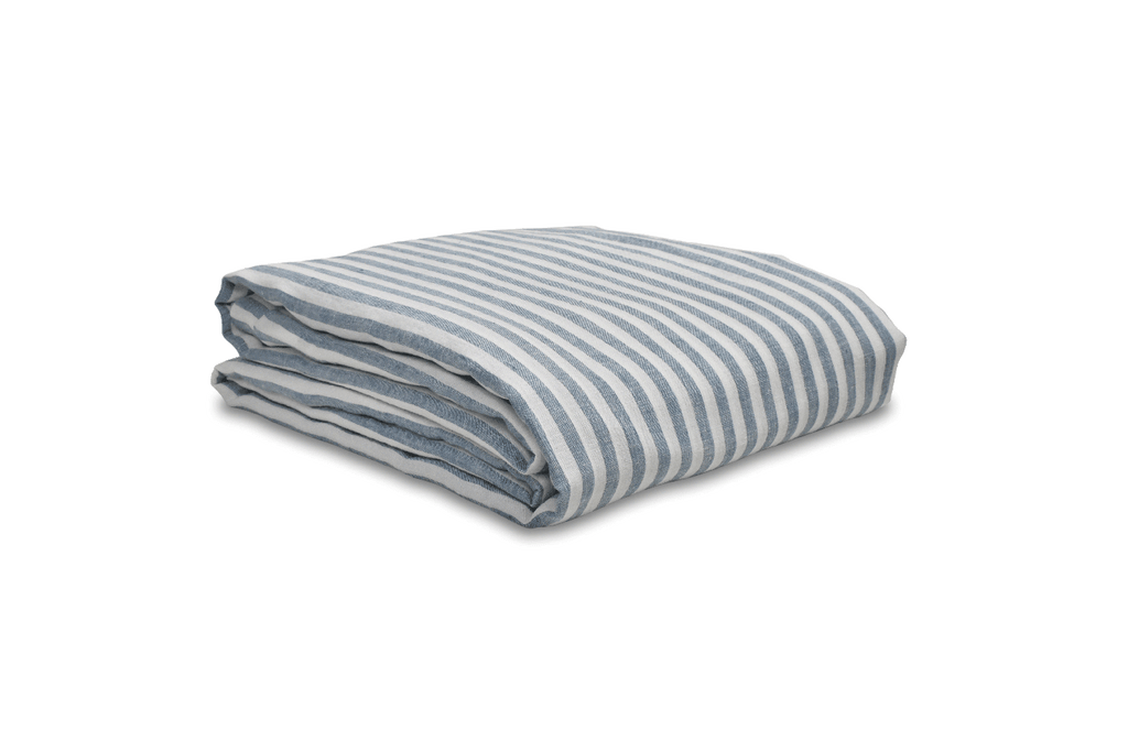 Stone Blue Ticking Stripe Linen Duvet Cover Folded on a White Sheet