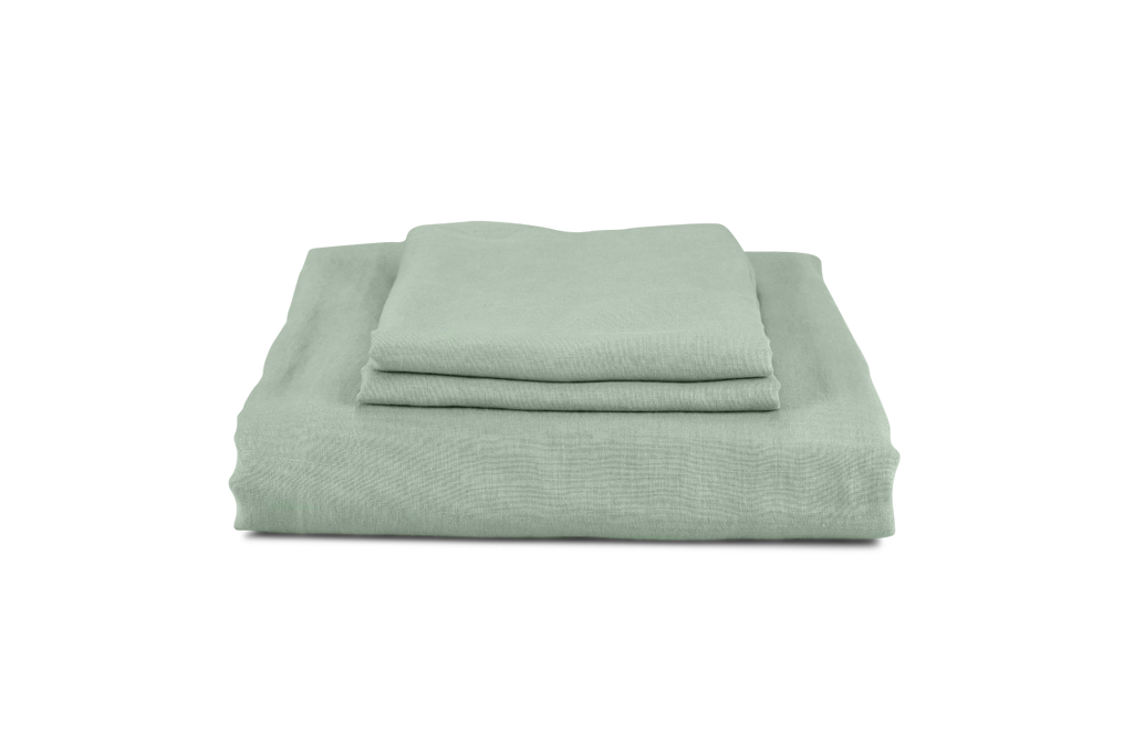 A Green Linen Bedding Set Folded with Green Linen Pillowcases on top
