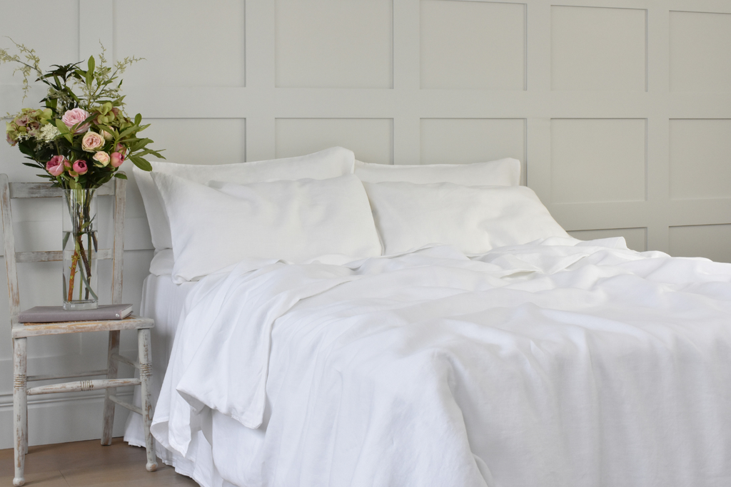 Soft White Pure Linen Quilt Cover with Flowers at the Side of the Bed